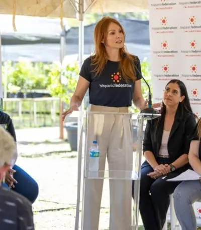 Puerto Rico director for Hispanic Federation leading a conference about USDA program to community members