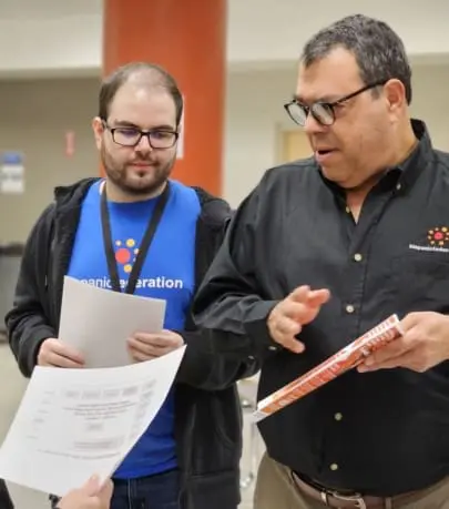 Senior leader talking to community member about voter registration