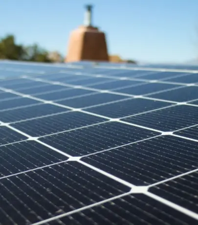 Close shot of a solar panel installation on a rooftop, in horizontal format